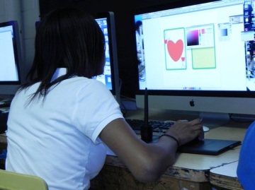 Students practice graphic design in a professional context - designing for real businesses.
