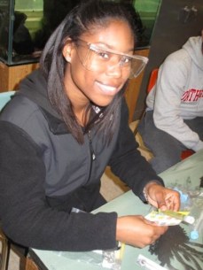 Students research water quality with samples they collected.