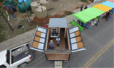 The mobile observatory from the STARS project. This picture was taken by drone of the director standing in the brand new facility. 