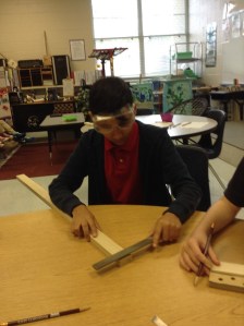 Students build cigar box guitars (Project photo).